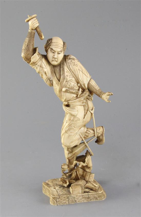 A Japanese ivory of a Samurai, Meiji period, 32.5cm, losses